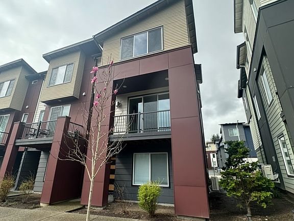 Corner unit with deck facing unobstructed greenery