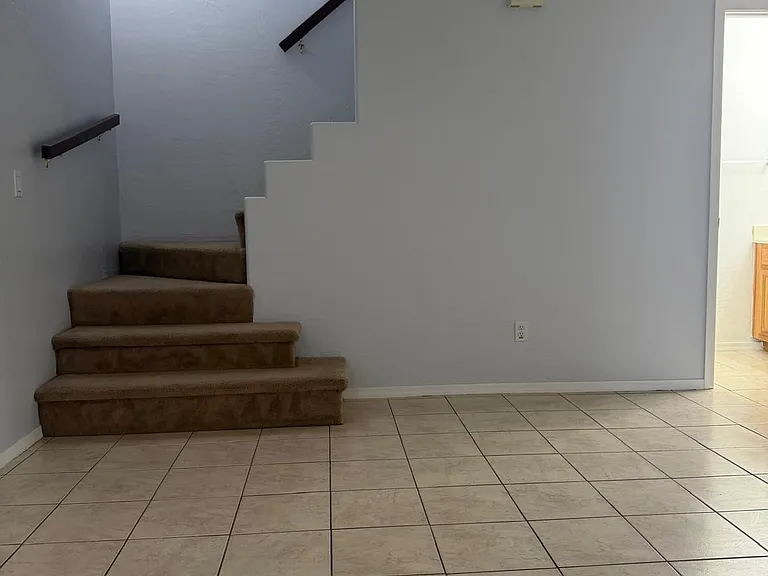 Accessible stairway for bringing material upstairs. Handrails for safety.