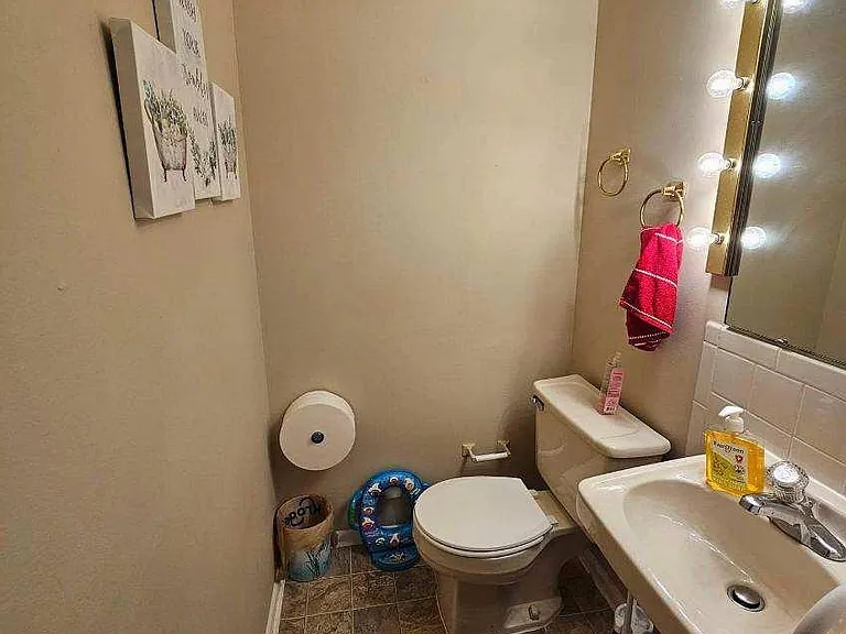 half bath downstairs off kitchen. I have not included a photo of living room