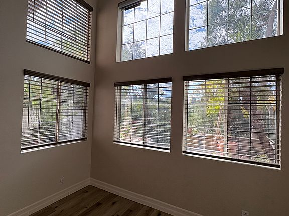 Living area with lots of windows.