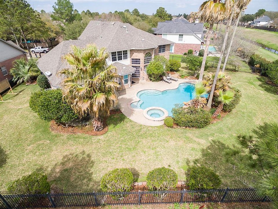 This is one of the largest lots in the area with a fabulous view of the golf course. Not only a beautiful pool area, but plenty of green space in the yard as well. Cart path is close by, but not directly behind the home. It's perfect!