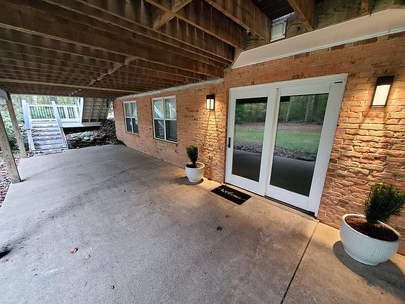 Lighted steps lead to your private patio and door