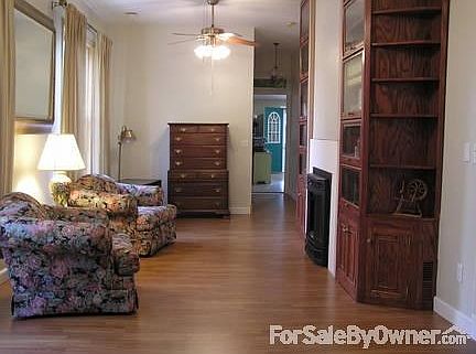 Library / Living room fireplace bookcase
						:
						10ft ceilings with a floor to ceiling oak barrister book case. Gas fireplace.
