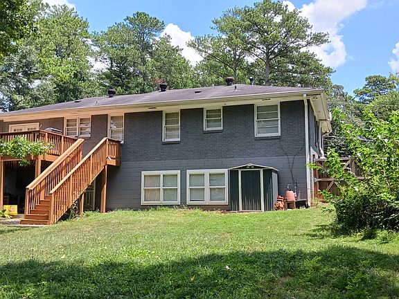 Back of house: The first floor sits above a full basement. French doors open onto a spacious deck overlooking the back yard.