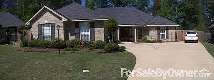 Front View
						:
						Large driveway with extra parking space. Elevated and set back from road