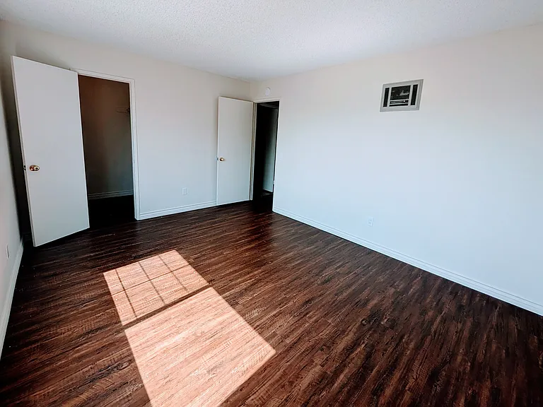 Bedroom, looking toward walk-in closet (door to the left).