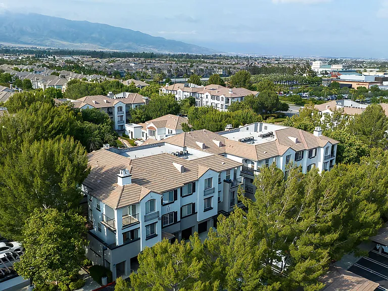 Scenic Aerial View of Villas at the Gardens Community with Tree-Lined Buildings