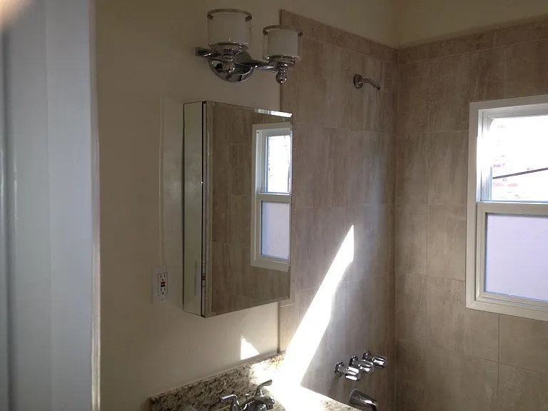 Tiled bathroom with a bath tub