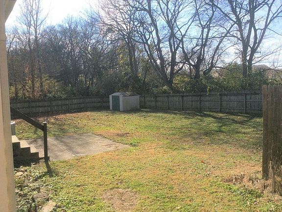 Huge fenced backyard & storage shed