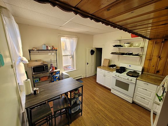 cart on the left with two bar stools for kitchen seating is included