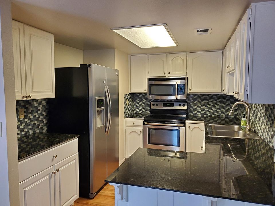 Updated kitchen with stainless steel appliances.