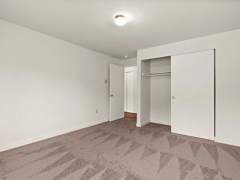 Relax in a freshly updated bedroom featuring plush carpet, ample closet space, and a bright, neutral palette ready for your personal touch. Relax in a freshly updated bedroom featuring plush carpet, ample closet space, and a bright, neutral palette ready 