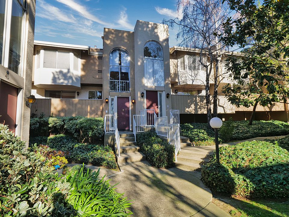 Front Door and deck with a view of the beautifully landscaped grounds