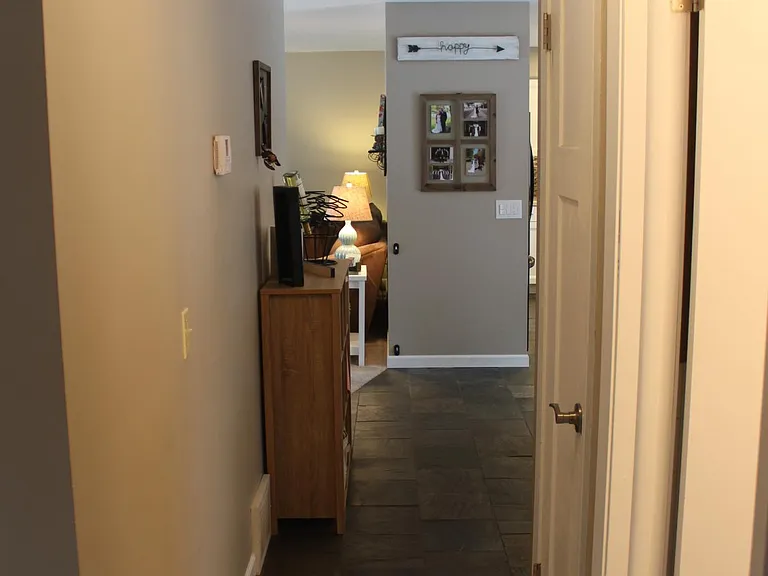 Hallway with linen closet.