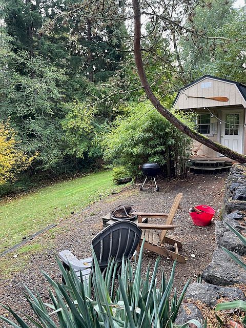 Full private lower lot with campfire space and yard.