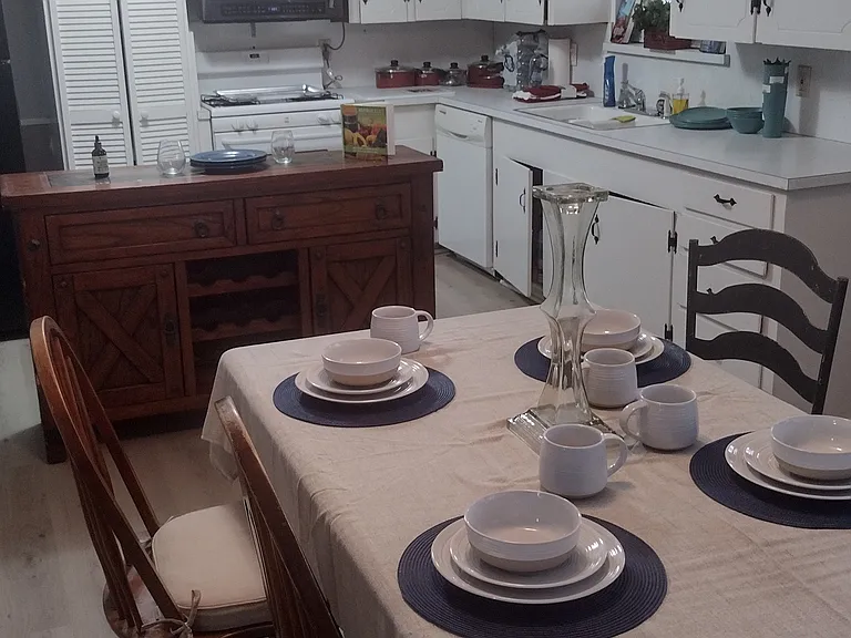 Large dinning table in dinning area.