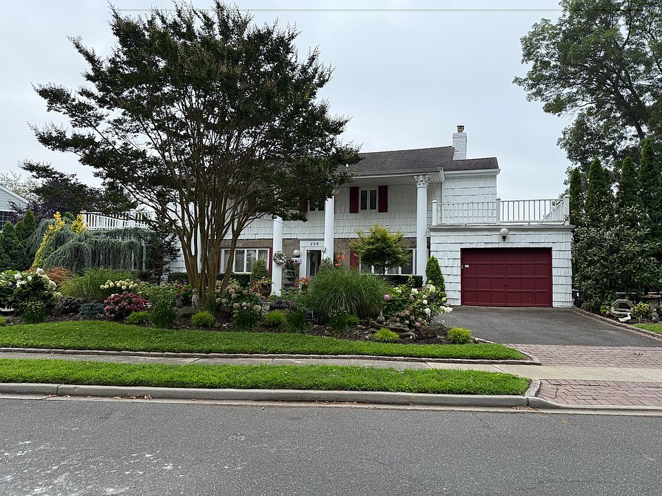 Charming residence located on a quiet, tree-lined street in Hewlett, NY.