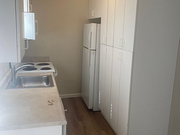 Kitchen features range, oven, microwave, and refrigerator