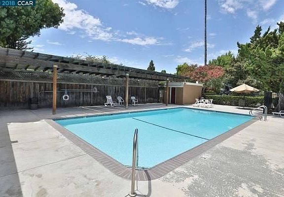 Condominium swimming with laundry room next door.