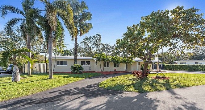 Tropical Front Exterior with Circular Driveway