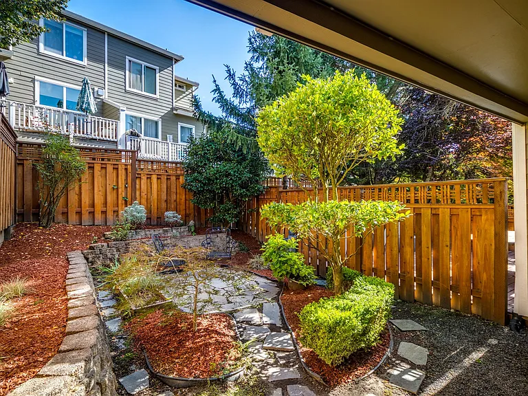 Fully fenced back yard with garden plot