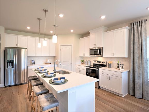 The large walk-in pantry and kitchen island make it easy to feed a group.