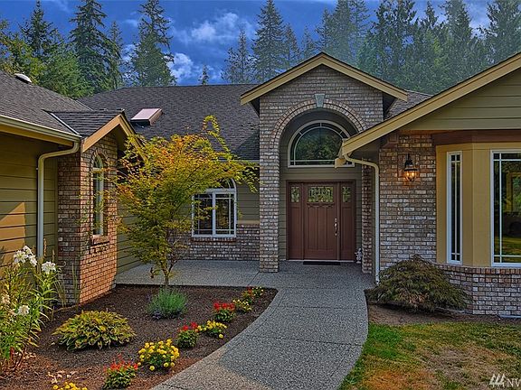 You are welcomed home by gorgeous landscape, light and bright brick entry with plenty of room for a nice seating area to watch the sunset.