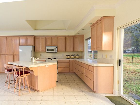 Kitchen with skylight, view of the pasture and wooded areas