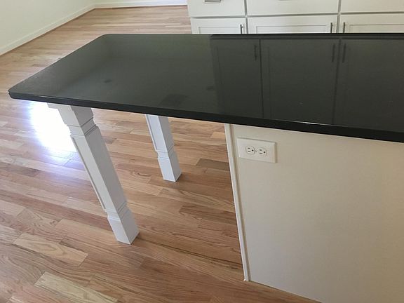 Granite countertops. Space for barstools.