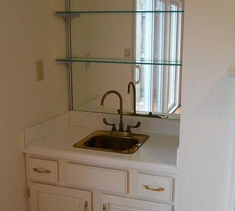 Wet bar next to w/b fireplace