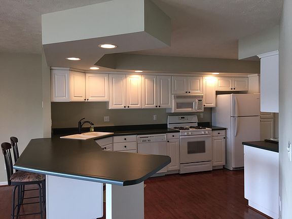 Open concept kitchen. Gas stove. Water softener in utility room in garage