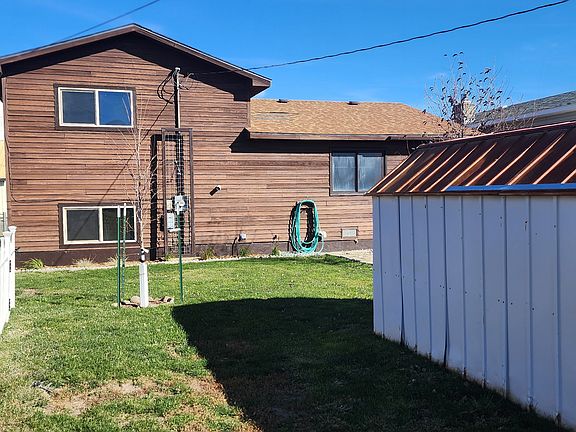 Back yard with storage shed and off street parking.