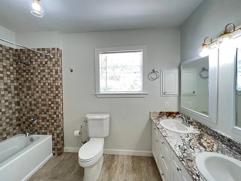 Large up-stairs bathroom with new sinks/ cabinets!