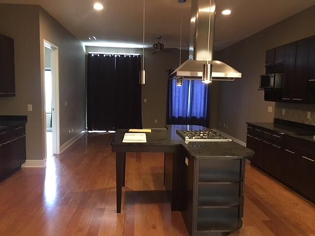 Built-in Granite Table and Hardwood Flooring