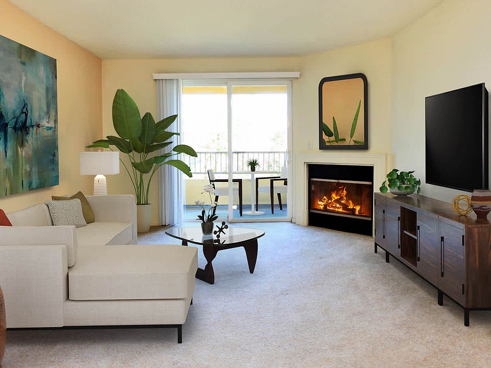 Living Room with Fireplace and Private Balcony