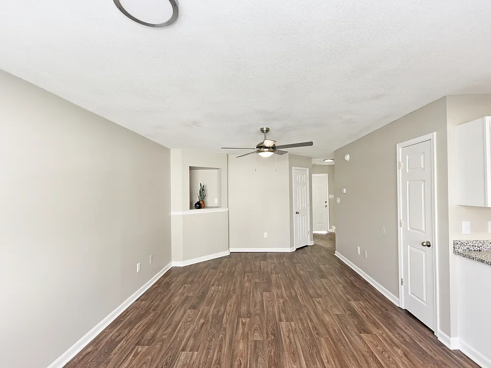 Spacious living room with hardwood-style flooring