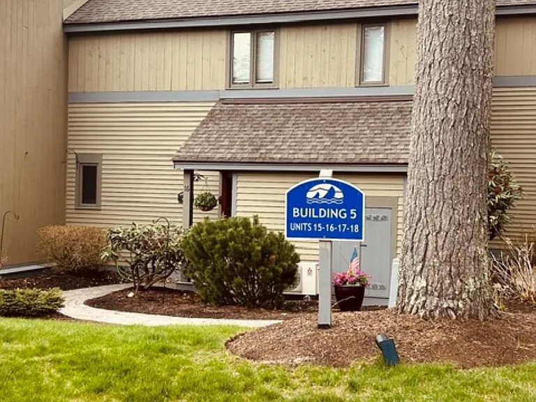 The reflective building and unit number.