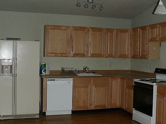 Open kitchen lets the cook enjoy her guests while cooking.