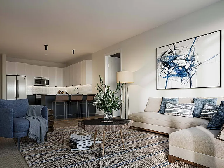 Relax in the living room, with a clear view of the kitchen, creating an open and connected space for everyday living.