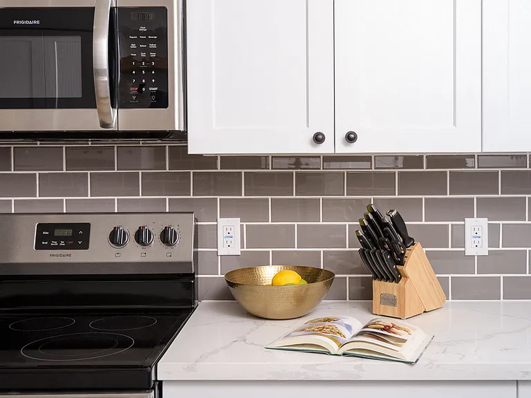Quartz countertops with subway tile backsplash