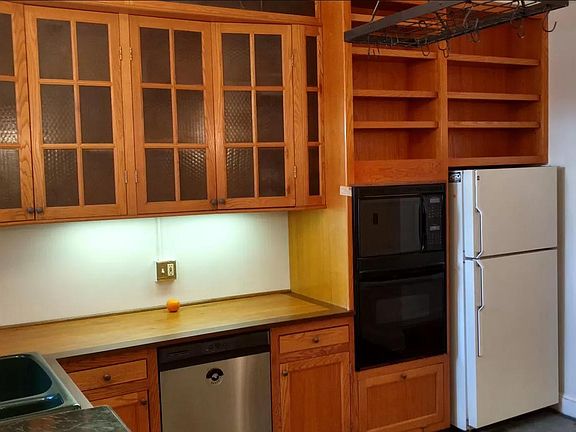 custom oak cabinets and a countertop trimmed in walnut