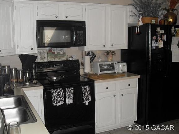 Kitchen has nice cabinets