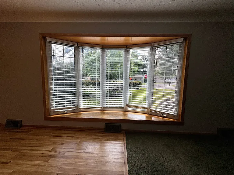 Large Bay Window offers southern exposure and expansive views of butterfly and pollinator gardens.