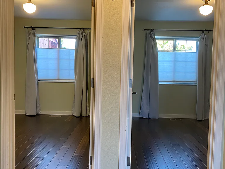 Doors to bedrooms are side by side.