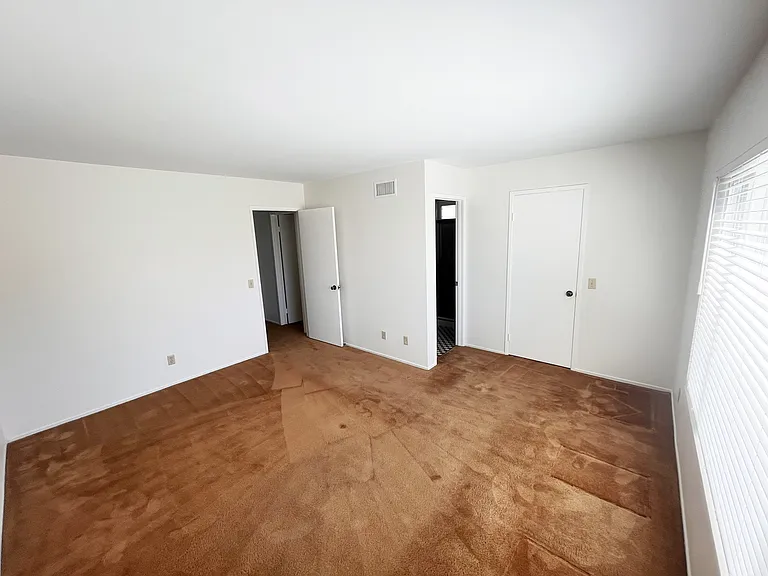 Master bedroom interior, with walk-in closet.