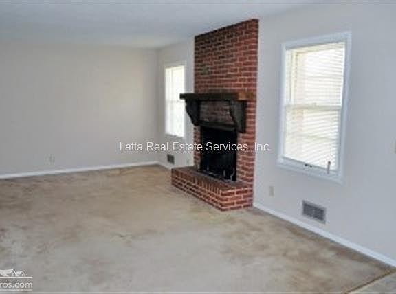 Living Room w/Wood-Burning Fireplace