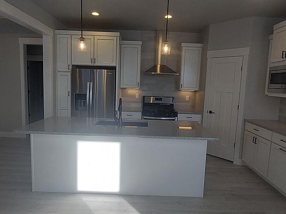 Kitchen Island and view of kitchen