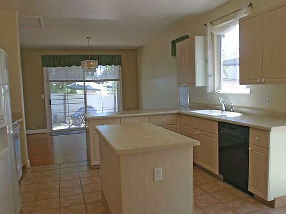 Kitchen open to yard and living room