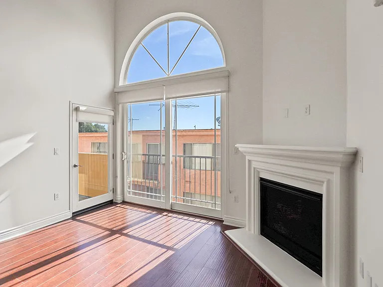 Living Room with Electric Fireplace and Patio