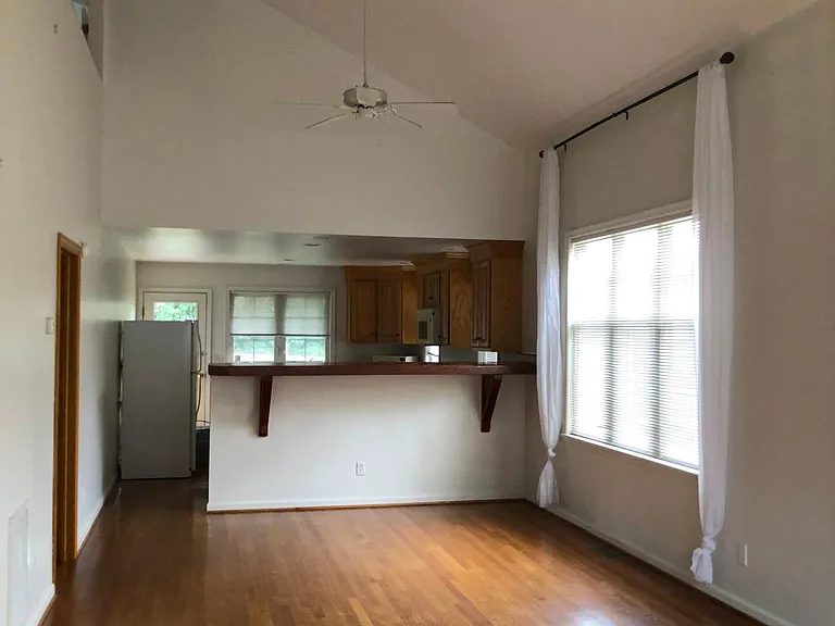Large living/dining area, open floor plan.